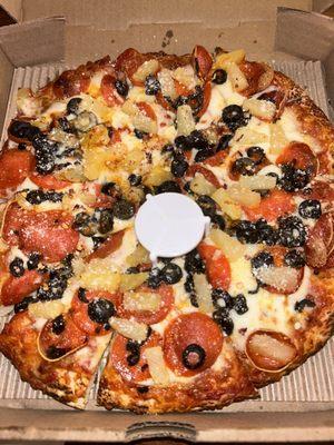 A small pizza with three toppings