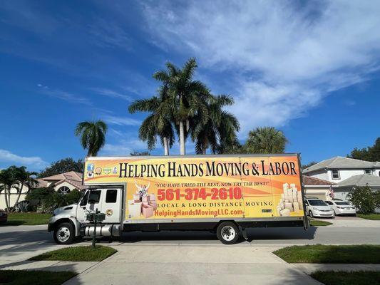 Helping Hands Moving truck on a sunny south Florida day