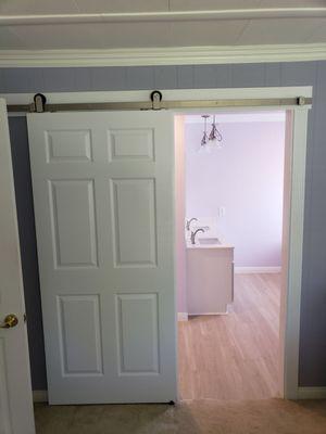 Exterior mounted pocket door