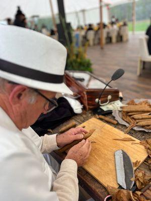 Rolling handmade cigars at the 74th Annual Pebble Beach Concours D'Elegance August 2023