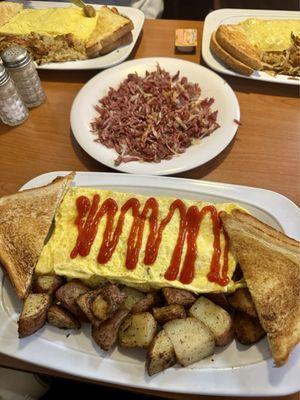 Ultimate Omelette with a side of large Corned Beef Hash.