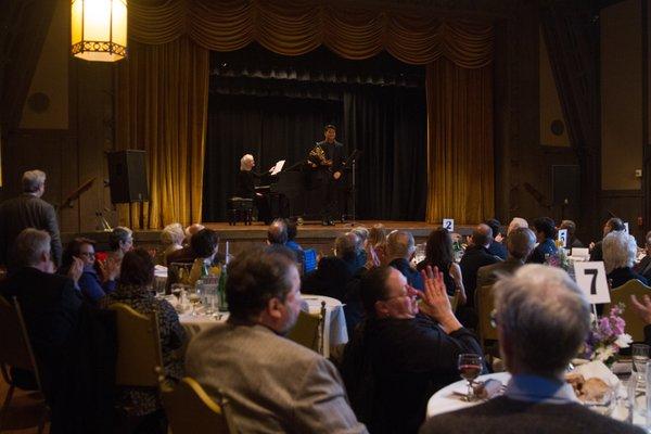 Musicians playing from the stage of Hillside Club