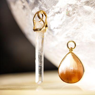 Two special pendants handmade in our shop. Natural Colombia Quartz crystal and a teardrop Rutilated Quartz. Both set in 14k gold