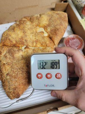 A delivered calzone. When separated there was no cheese stretch. I had to reheat this immediately upon receiving it.