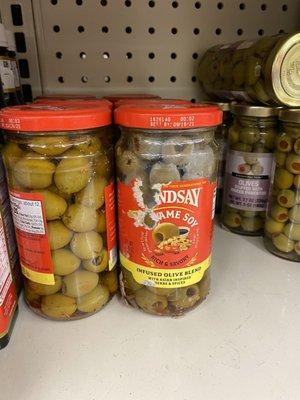 Rotten moldy green olives in plain sight