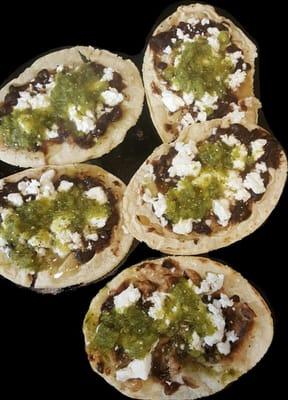 memelitas, hand made tortillas with black, beans, cheese n green salsa.