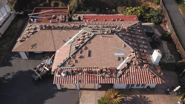 Tiles back in place, a sturdy roof takes shape beneath the sun in Vista, CA | Photo 2 of 4