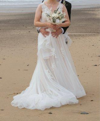 The dress was shortened in front (but left a train) and reattached horsehair trim