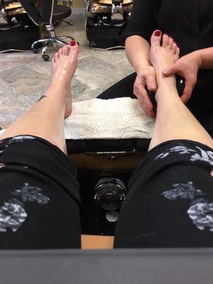 Deluxe pedicure includes hot rock massage and paraffin foot mask