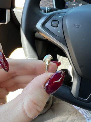 My solid gold opal ring after I damaged it - the opal is scratched / dull and the ring is twisted.