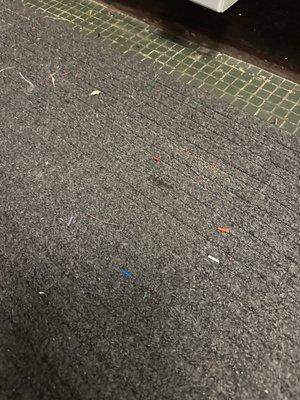 wire bits and debris left on the carpet after installation