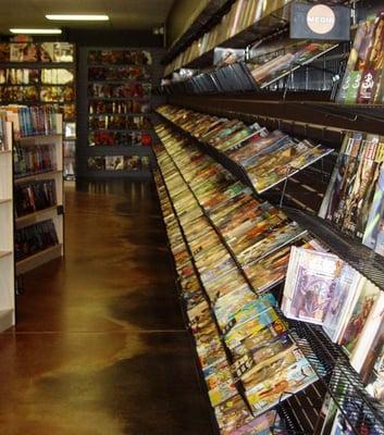 Our 40 foot wall of new comics, where we stock 2 to 3 issues back on most titles!