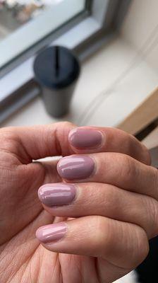 The middle two nails have extra layers and differ in color from the other two.