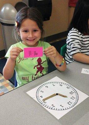 Learning how to tell time.