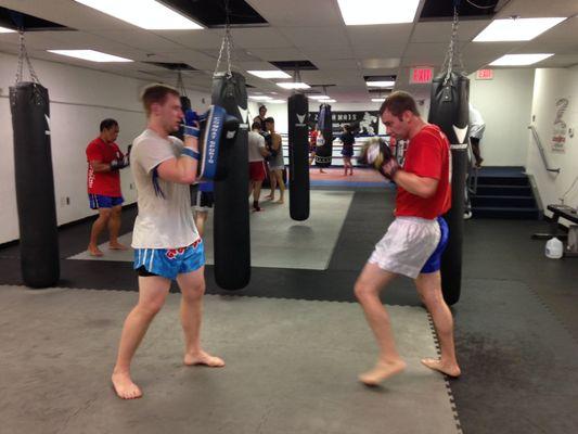 Muay Thai class working on their boxing