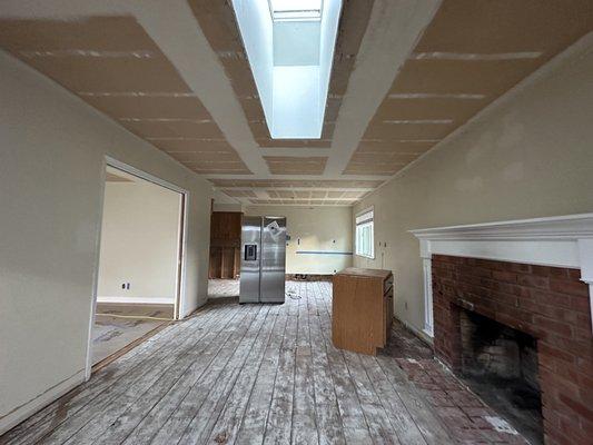 The popcorn ceiling and the old linoleum floor are gone.