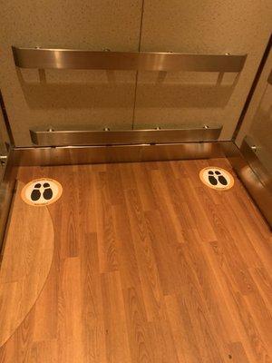 Social distance markers in the elevator