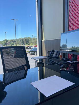 Empty desk. Our sales person left us sitting here for a good 30 minutes. Do not recommend this person. I don't care if he seems nice.