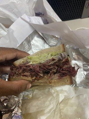 Look at the two colors of bread! One regular since the lettuce was a barrier. The other darkened with grease. Horrible!