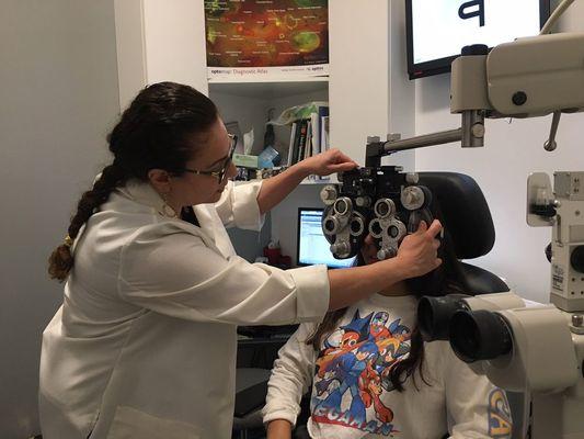 Doctor helping a young patient.