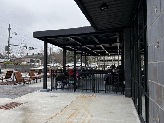 The outdoor covered patio is on the side.