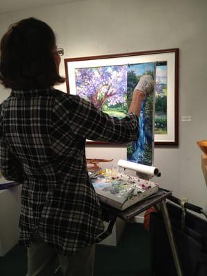 Betty Hay Freeland painting a waterfall