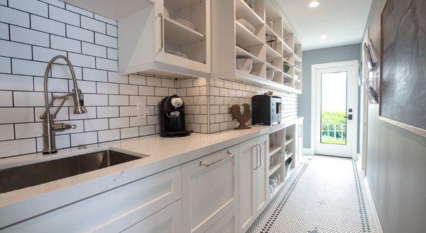 This Temecula CA Kitchen Butlery Features Shaker White Frameless European Style Cabinetry and Marble Stone Countertops.