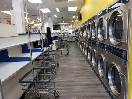 2 walls dedicated to these high performance dryers. 
Lots of dryers and a lot of folding space.