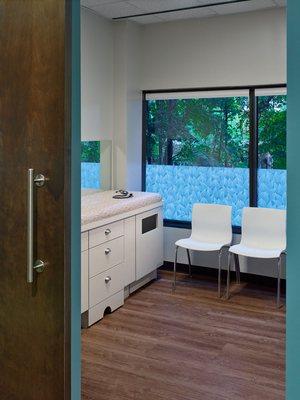 Most of the exam rooms look out at trees - leaf privacy film and lowered blinds for privacy