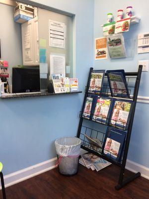 Magazine rack and sign-in window