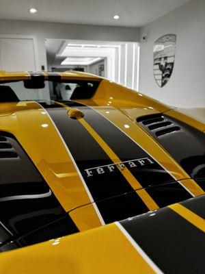 Ferrari dual stripes done in gloss black PPF. 10 year warranty, doesn't fade, self healing.