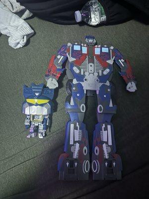 Sound wave funko pop and Optimus prime dvd holder that transforms