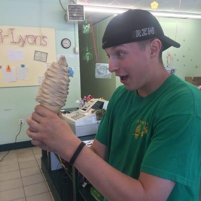 Dandi employee enjoying an extra large cone of our new coffee soft serve