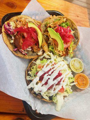 panuchos (corn tortilla stuffed with black beans) with roasted pork and chicken, and spinach sope with carne asada