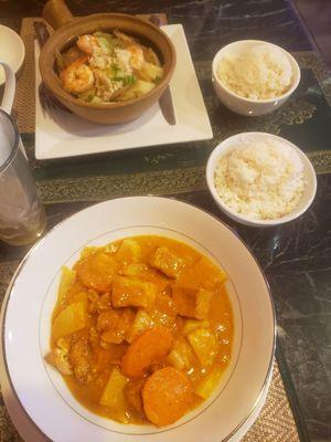 Shrimp in a Clay pot in the back. Massaman Tofu with extra potatoes in the front