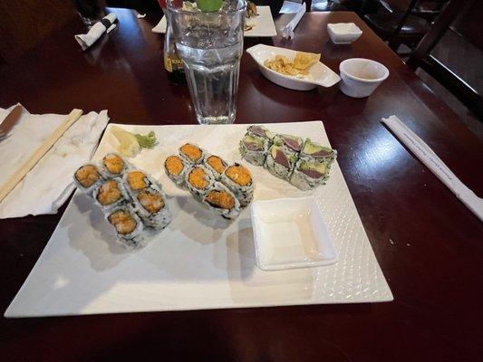 Three rolls - - two spicy rolls, and one tuna avocado roll. The spicy rolls were salmon and yellowtail.