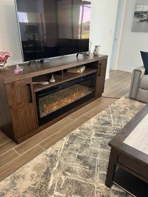 Electric fireplace. And TV stand. Looks so real.