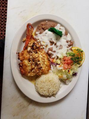 Lobster tail with garlic, along with rice and beans