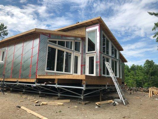 A new cottage along the river sitting on a MultiPoint Foundation