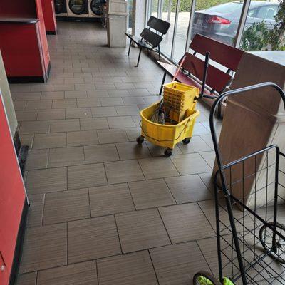 Mop left, so customers can clean up after themselves.