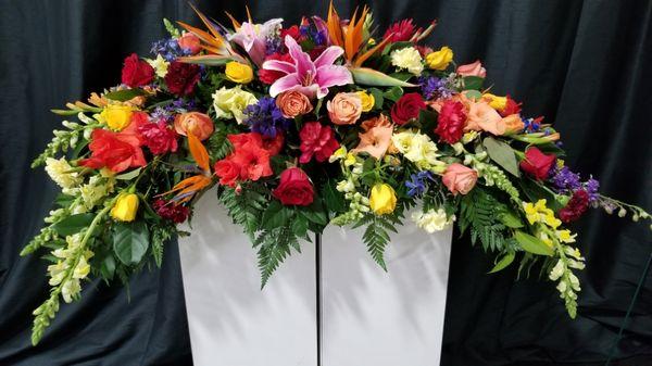 Tropical arrangement with other beautiful flowers that would last you for a long time can you be used for a casket or wedding head table