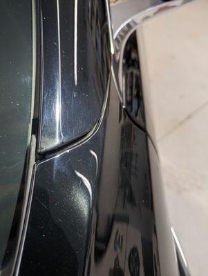 Clear overspray in an area on the *opposite* side of the car they worked on.