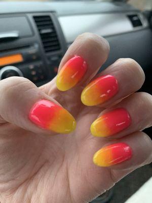 Sunset nails done with dip.