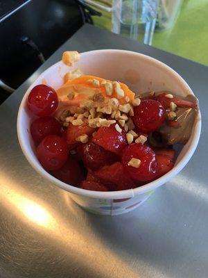 Orange Dreamsicle, chocolate yogurt w cherries, peanuts and strawberries. Mmm.