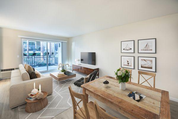 Modern living room and dining room with staged furniture and oversized sliding glass door.