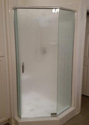 Semi-frameless shower enclosure