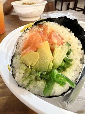 Sushirito, made own with salmon, seaweed salad, avocado, etc.