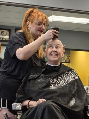 Getting the clipping and electric razor steps done before straight blade head shaving.