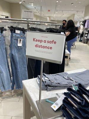 Social distancing signs placed throughout the store