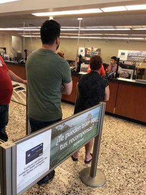 2 bank teller and line is out the door.